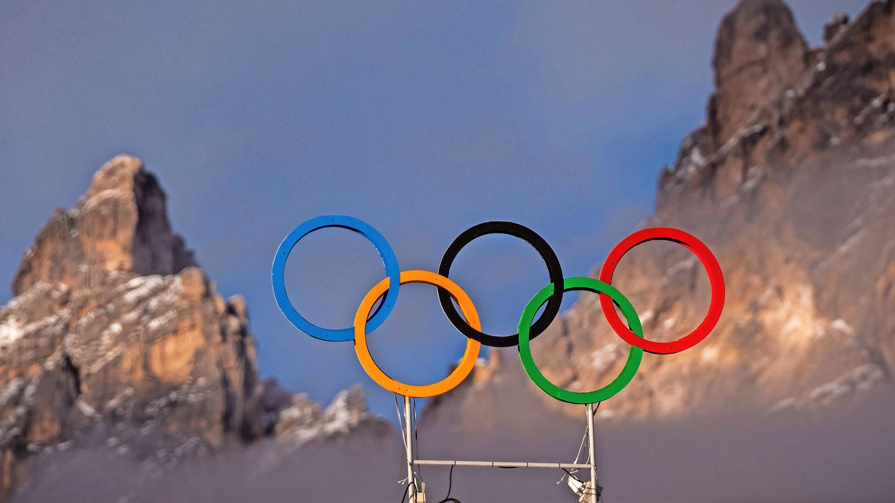 Olympia 2026 in den Alpen: Die einen sehen Spektakel, die anderen Zerstörung
