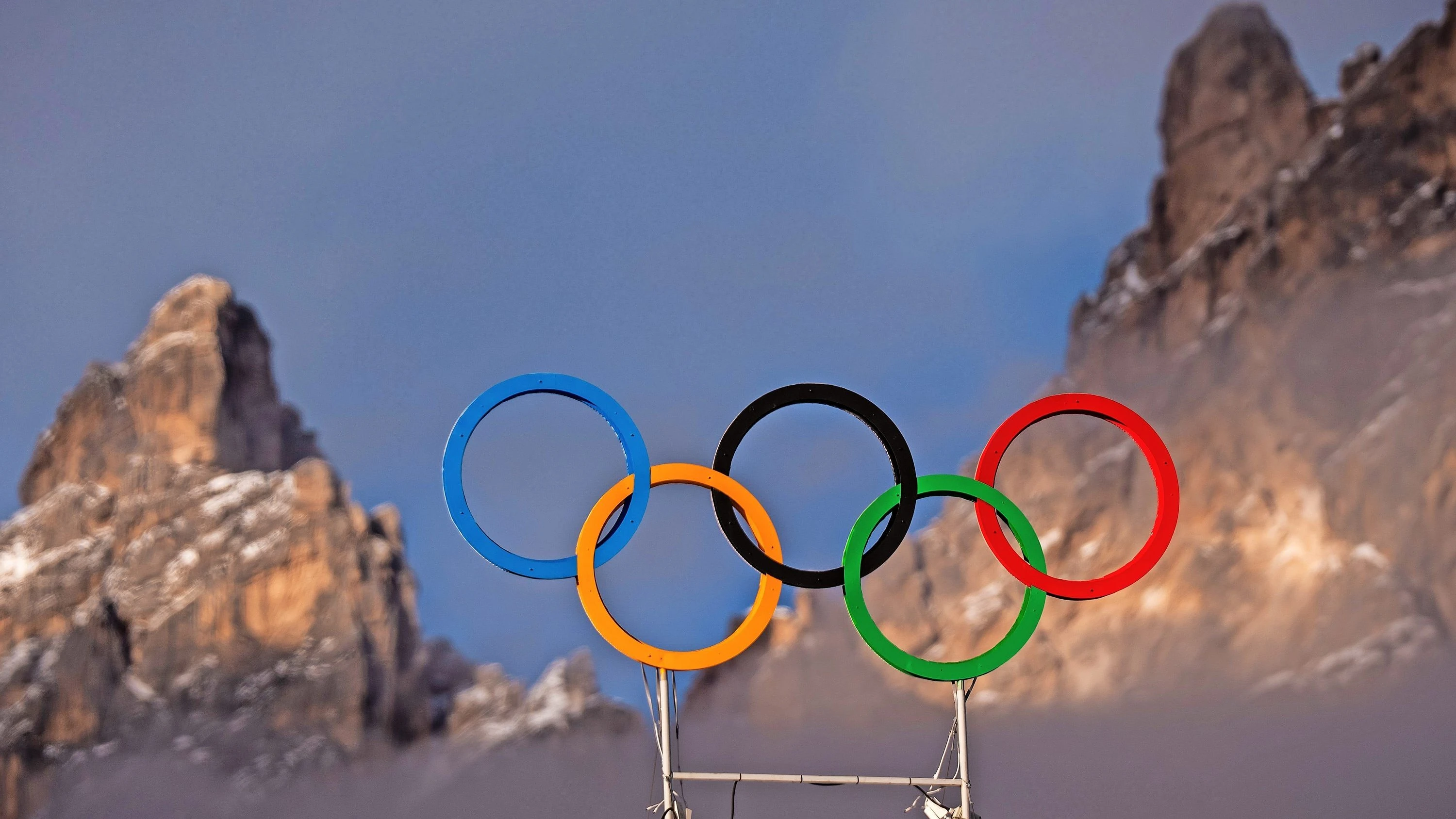 Olympia 2026 in den Alpen: Die einen sehen Spektakel, die anderen Zerstörung