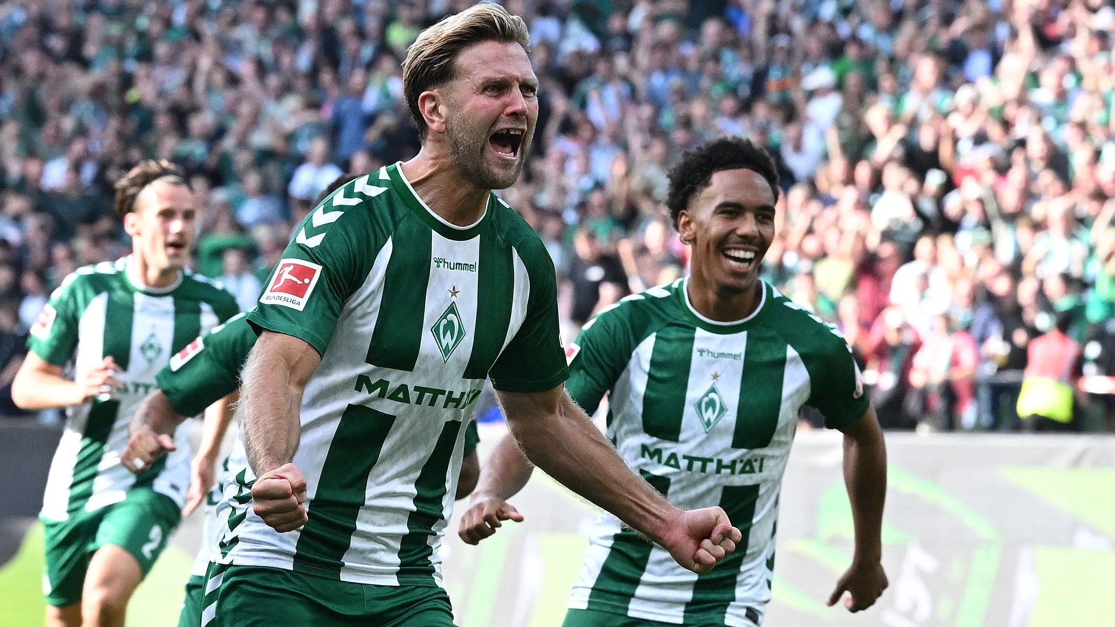 „Es sollte so sein“: Niclas Füllkrug brüllt seine Freude heraus. - dpa