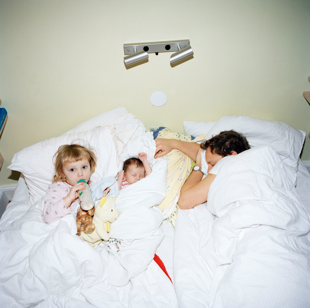 A family lying in bed, Sweden