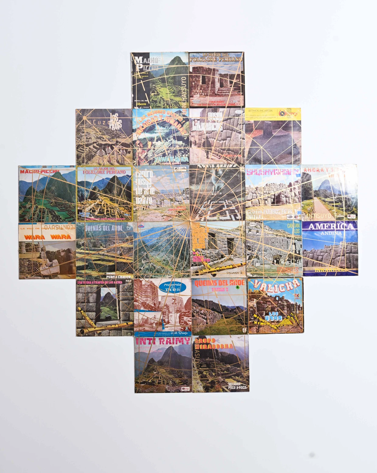 Solar iconography: In Mariano León's cross made from folklore record covers, textile-like golden rays of sun and path networks emanate from Inca monuments.