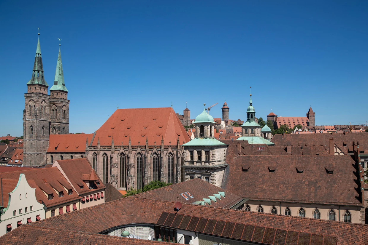 View from a Ferris wheel to the Church of St. Sebald (left) and the Imperial Castle (back center) over the roofs of Nuremberg's old town