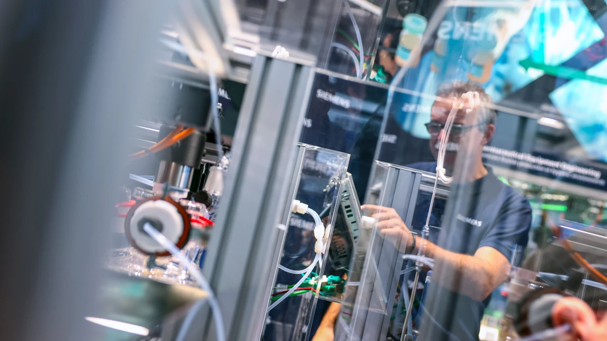 An employee at the Siemens stand at the Hannover Messe.