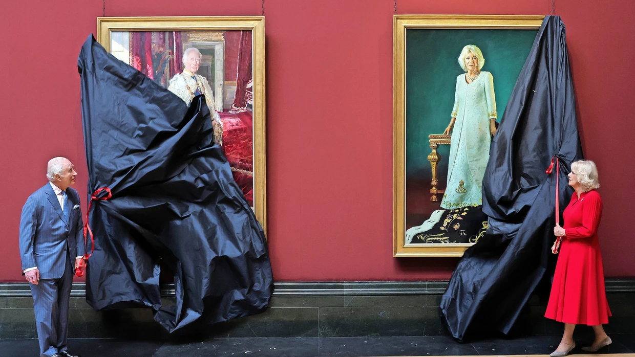 King Charles III and Queen Camilla unveil their coronation portraits at the National Gallery in London.