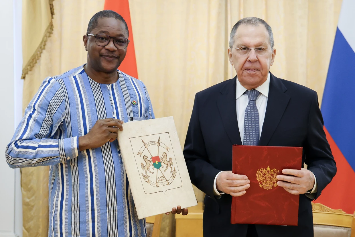 Burkina Faso's Foreign Minister Karamoko Jean Marie Traore with Russia's Foreign Minister Sergei Lavrov in Moscow on February 12.