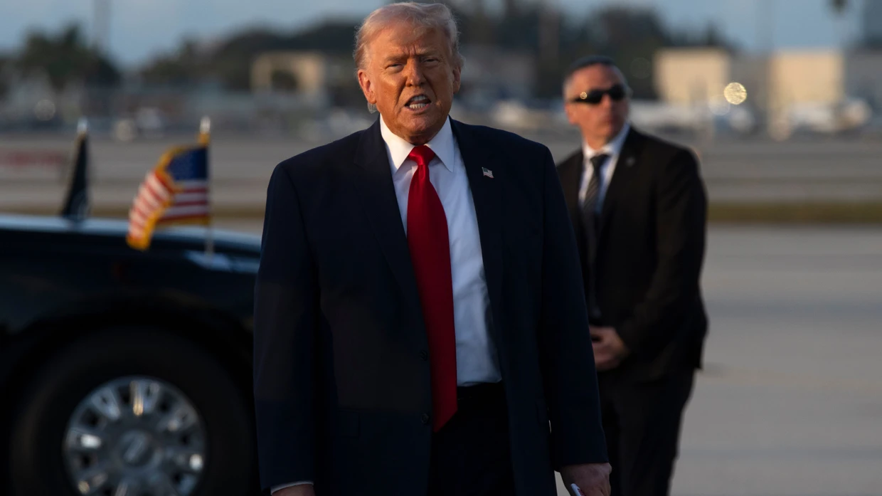 President Donald Trump gestures after stepping off Air Force One, Saturday, March 7, 2026, at Miami International Airport in Miami. (AP Photo/Mark Schiefelbein)