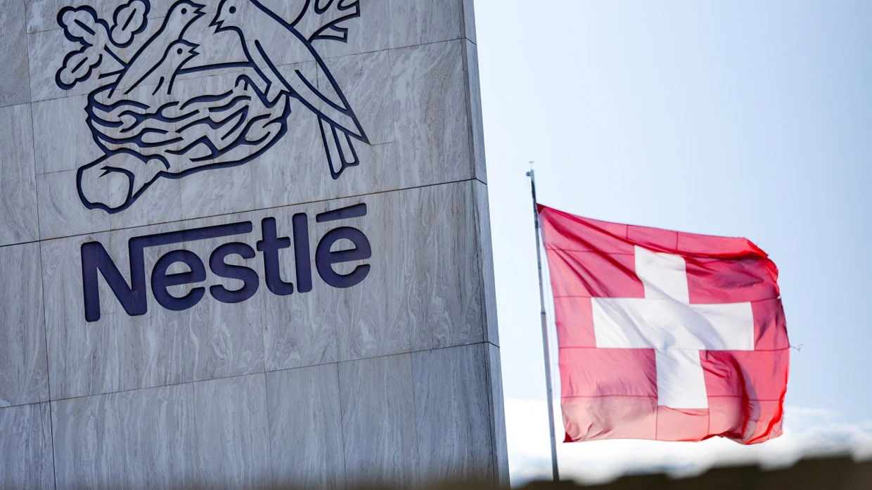 FILE PHOTO: A Swiss flag flutters on the headquarters of Nestle in Vevey, Switzerland, November 25, 2024. REUTERS/Denis Balibouse/File Photo