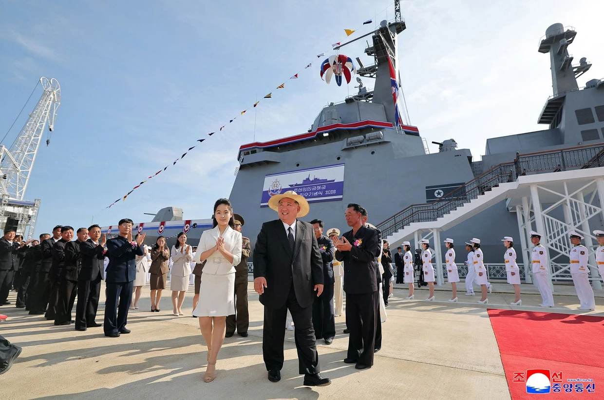 Kim Jong-un with his daughter at the launch of a new destroyer in Rason.