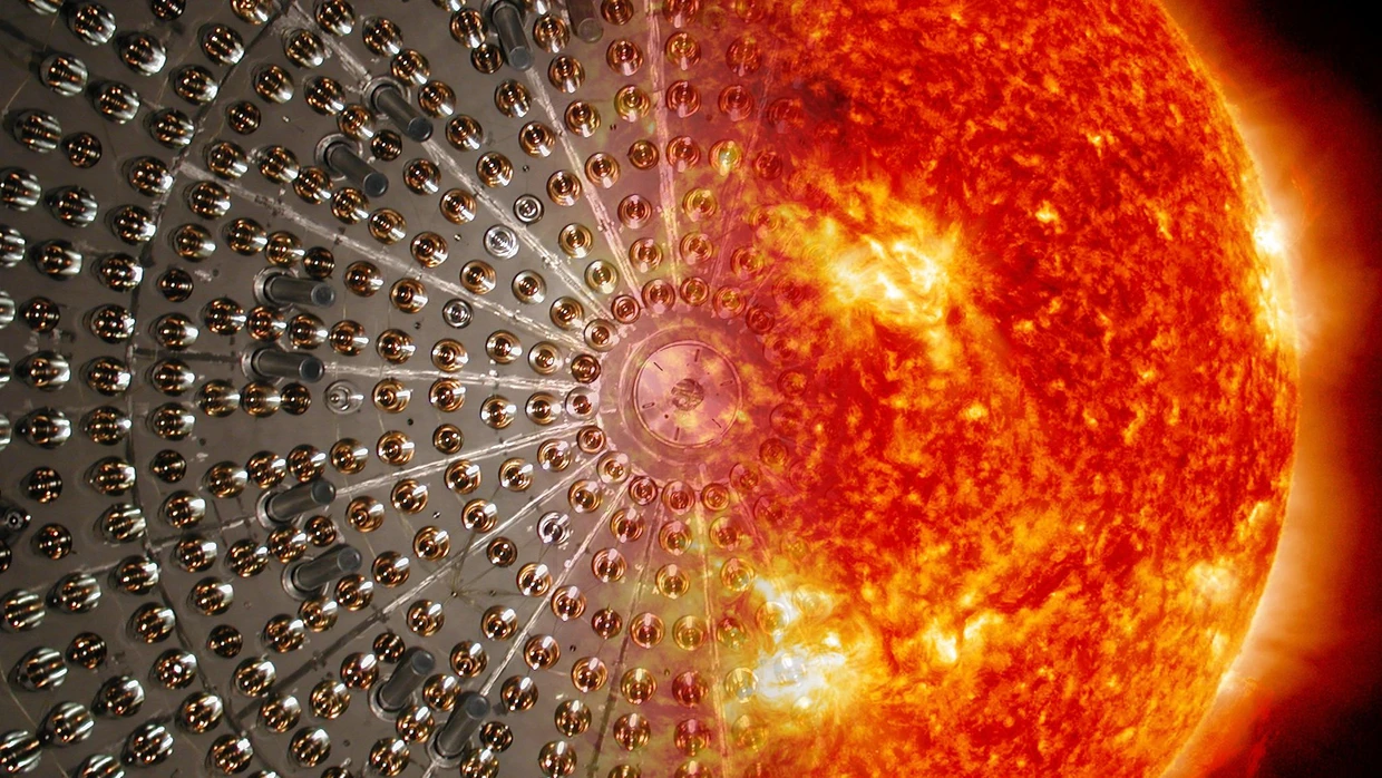 Künstlerische Darstellung der Borexino-Edelstahlkugel mit der Sonne: Im Gran-Sasso-Untergrundlabor misst das Experiment solare Niedrigenergie-Neutrinos.