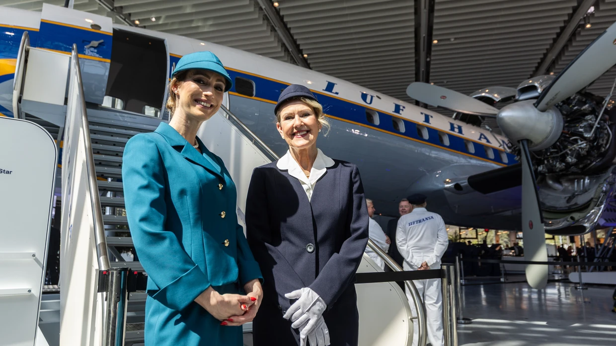 A company steeped in tradition: Lufthansa employees show off historical uniforms for the anniversary.