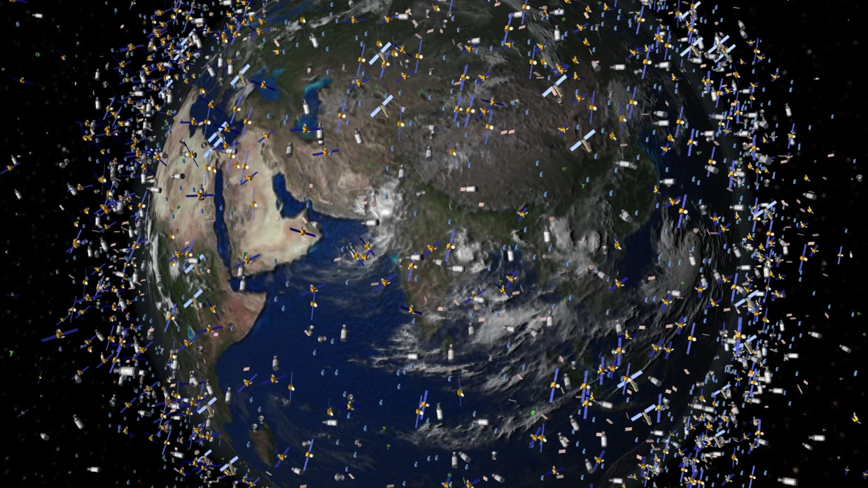 Das computergenerierte Bild der ESA zeigt Weltraummüll, der neben intakten Satelliten um die Erde kreist