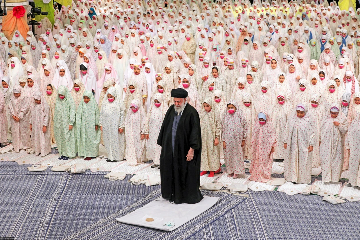 Khamenei praying together with Iranian girls in 2023
