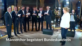 Georgischer Männerchor begeistert Merkel
