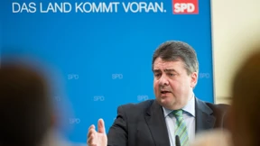 Und Merkel lächelt trotzdem