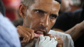 Migranten in Mexiko nähen sich aus Protest Münder zu