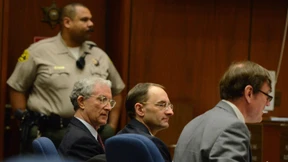 „Mr. Rockefeller“ lächelt von der Anklagebank 