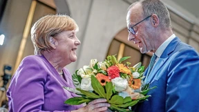 Merz, Merkel und die Nationalmannschaft