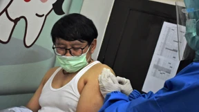 Corona-Impfung mit Fragezeichen