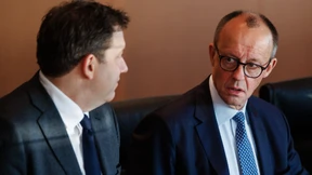 Merz und Klingbeil fordern digitalen Euro als Absicherung gegen Dollar