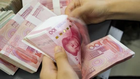 Geldscheine in China müssen in Quarantäne