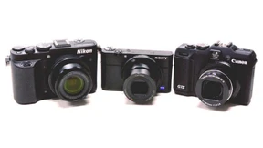 Drei kleine Spiegelreflexkameras