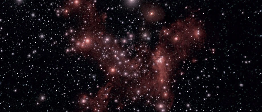 Sterne und Gaswolken driften um das unsichtbare Schwarze Loch Sagittarius A* im Zentrum unserer Galaxis.