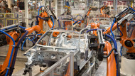 Teile eines Volkswagens werden im Karosseriewerk im Volkswagen Werk Emden von Robotern zusammengefügt. Teile eines Volkswagens werden im Karosseriewerk im Volkswagen Werk Emden von Robotern zusammengefügt.